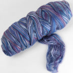 Picture of a batt of New Zealand Merino and Silk unspun fibre dyed in multi-colour blues