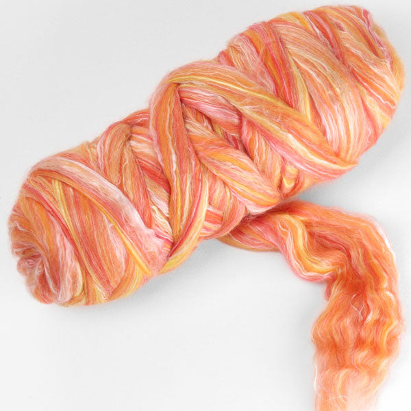 Picture of a batt of New Zealand Merino and Silk unspun fibre dyed in multi-colour oranges