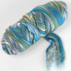 Picture of a batt of New Zealand Merino and Silk unspun fibre dyed in multi-colour blues and greens