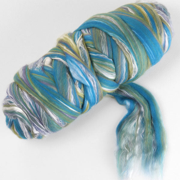 Picture of a batt of New Zealand Merino and Silk unspun fibre dyed in multi-colour blues and greens