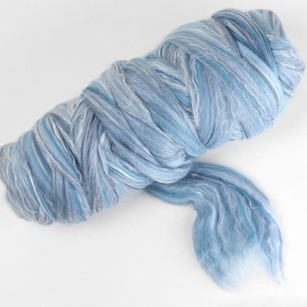 Picture of a batt of New Zealand Merino and Silk unspun fibre dyed in multi-colour sky blues