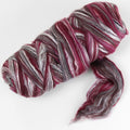 Picture of a batt of New Zealand Merino and Silk unspun fibre dyed in multi-colour storm purples and reds