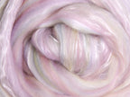 Close up picture of a sample of New Zealand Merino and Silk unspun fibre dyed in multi-colour light sorbet pinks