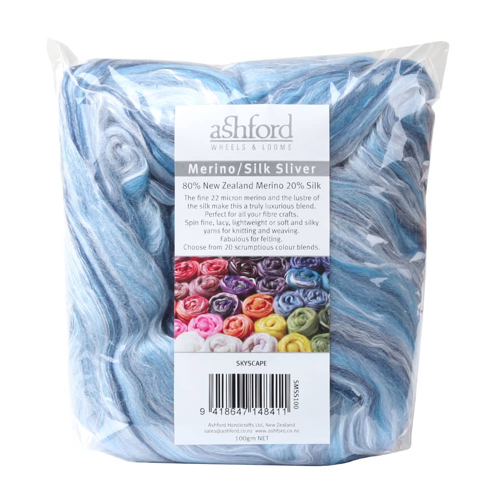 Picture of the packaging of 100 grams of New Zealand Merino and Silk unspun fibre dyed in multi-colour sky blues