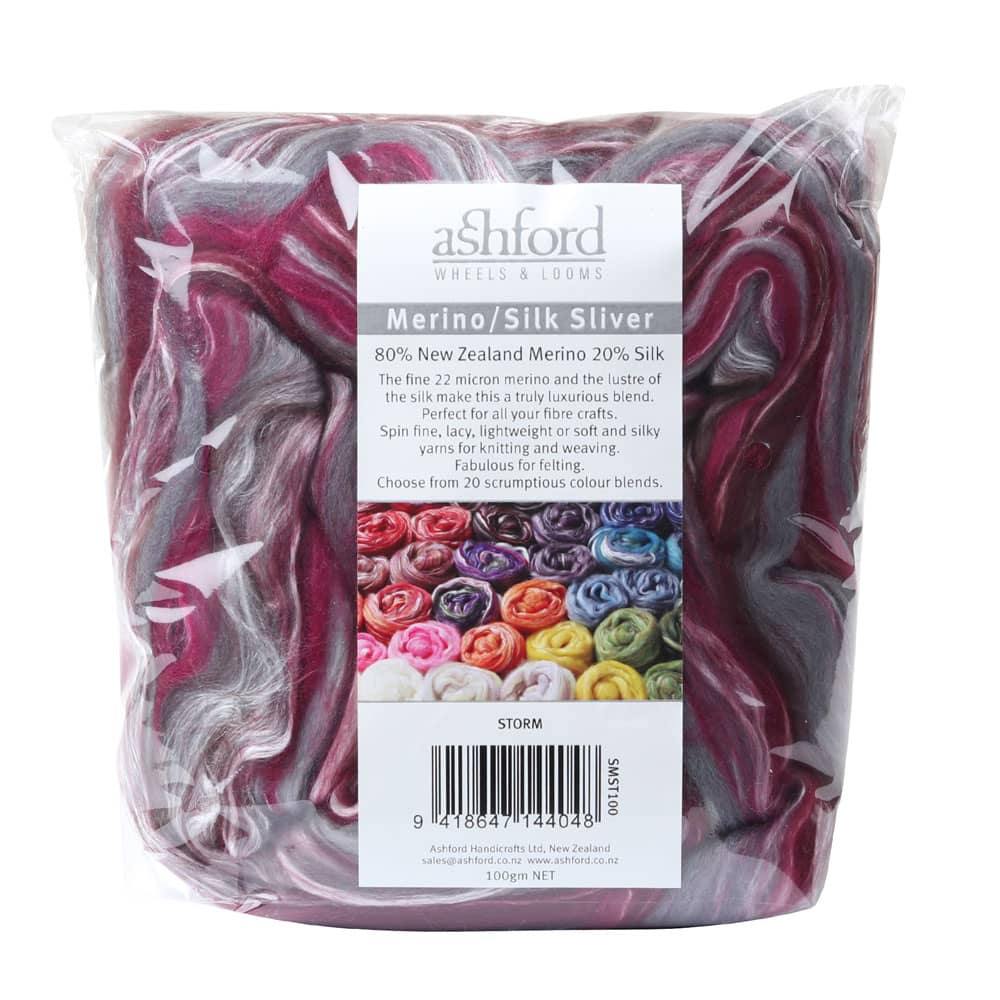 Picture of the packaging of 100 grams of New Zealand Merino and Silk unspun fibre dyed in multi-colour storm purples and reds