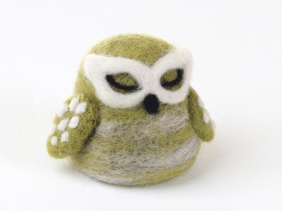 Sample of a needle felted New Zealand Little Green Owl on a white background