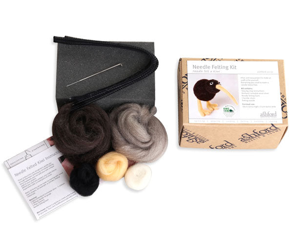 Needle felting kit with wool, needles, and instructions on a white background