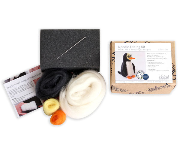 Needle felting kit with materials and instructions on a white background