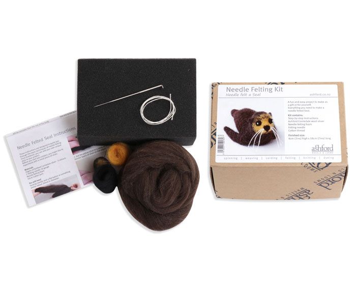 Needle felting kit with  wool, a needle, and instructions on a white background.