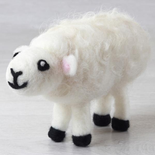 Sample of a needle felted New Zealand Sheep on a white background