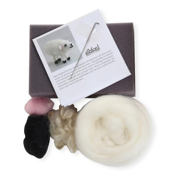 Needle felting kit with materials and instructions on a white background