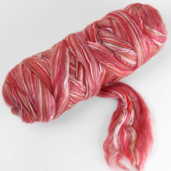 Picture of a batt of New Zealand Merino and Silk unspun fibre dyed in multi-colour pomegranite reds