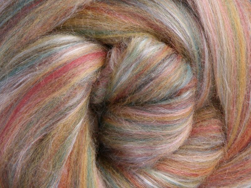 Close up picture of a sample of New Zealand Merino and Silk unspun fibre dyed in multi-colour cinnamon beiges and browns