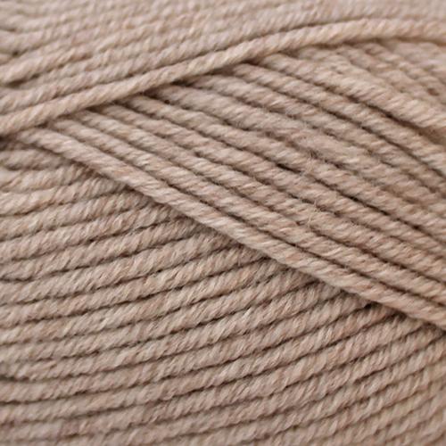 Close-up of beige yarn with a slight texture