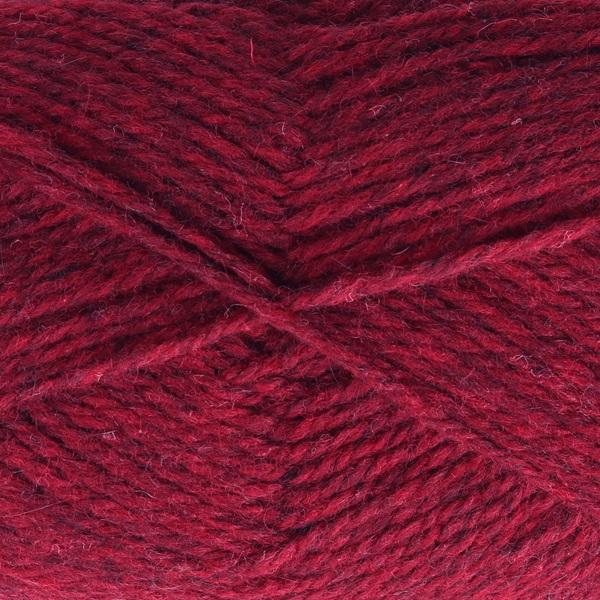 Close-up of dark red yarn with a tweedy texture