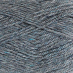 Close-up of medium denim blue-grey  yarn with a tweedy texture