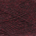 Close-up of dark rust yarn with a tweedy texture