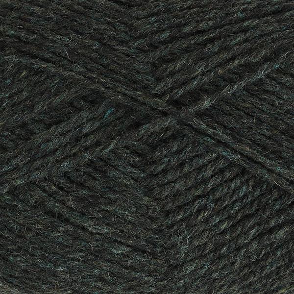Close-up of dark forest green yarn with a tweedy texture