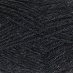 Close-up of dark charcoal grey yarn with a tweedy texture