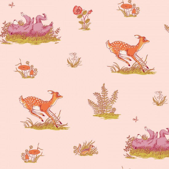 Quilt Fabric with a whimsical animal print featuring deer, bears, mushrooms, and ferns on a blush pink background.