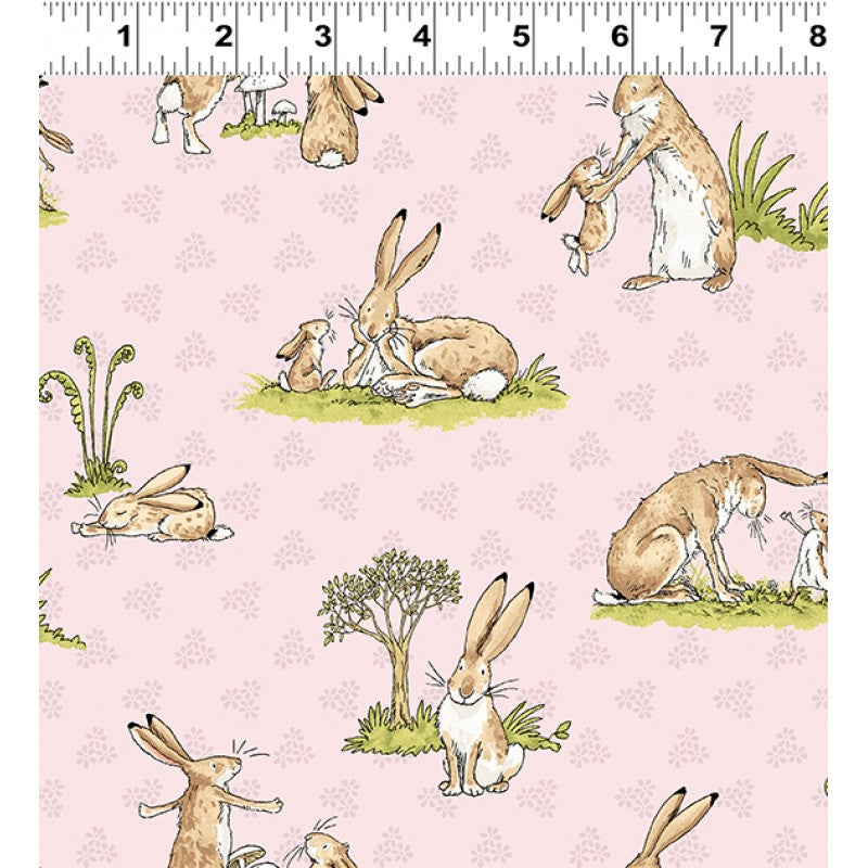 Children's Quilting fabric with a pink background featuring illustrations of rabbits and other animals.