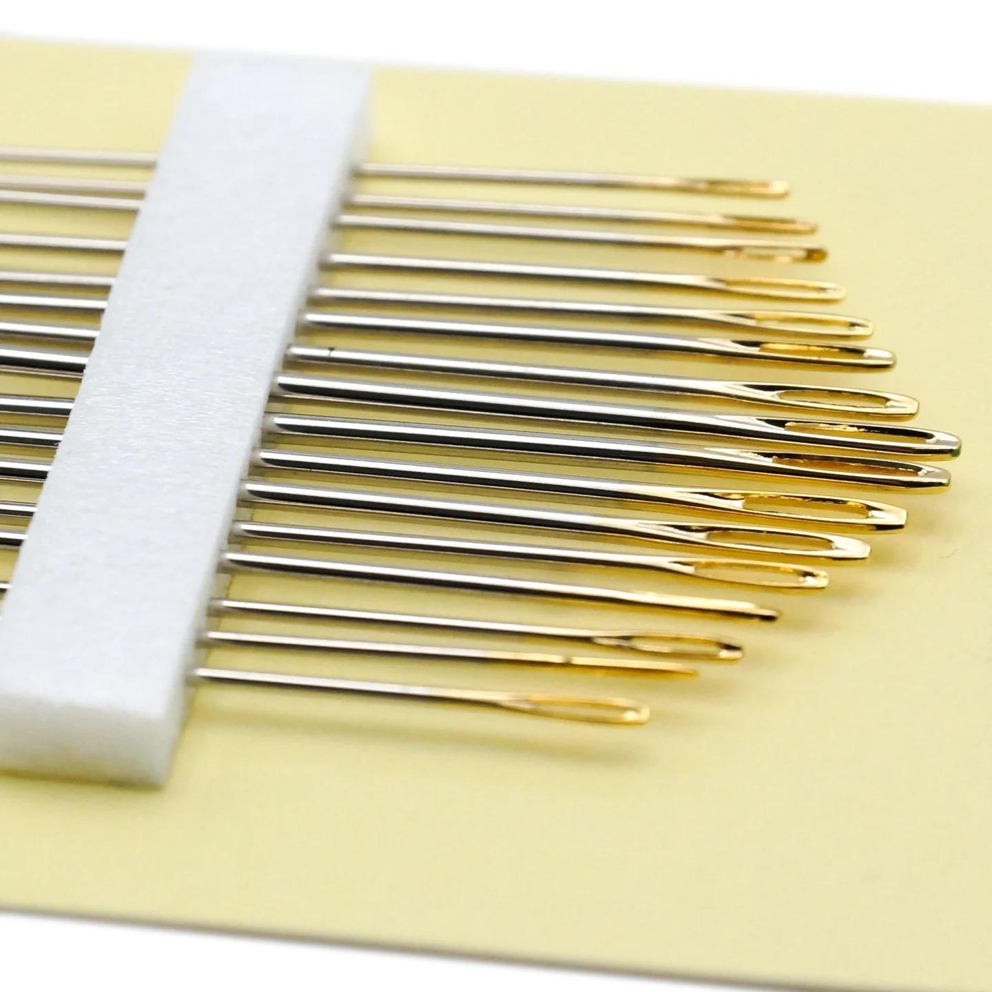 Pack of Gold Eye Embroidery Needles by Clover on a white background with close up of gold eyes