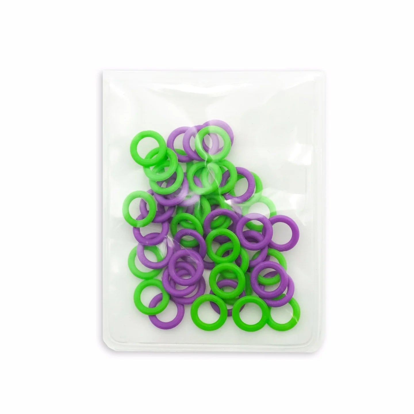 Green and purple stitch markers in a clear plastic storage pouch on a white background