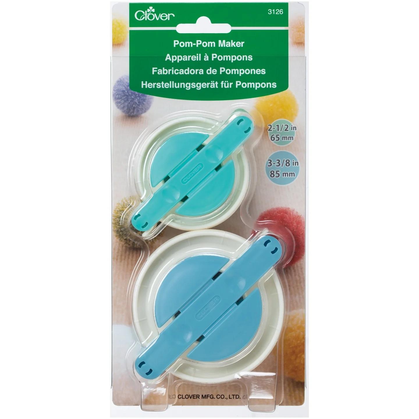 Pom-pom maker packaging with two circular cutters on a white background