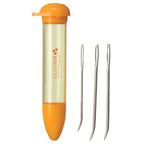 Clover needle case with orange lid and bottom, containing needles on a white background