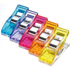 Close up of Clover Wonder Clips with colorful clips on a white background
