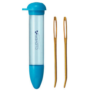 Clover needle case with two jumbo needles on a white background