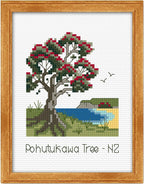 Cross-stitched design of a Pohutukawa tree with berries and a lake, framed in wood.