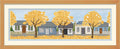 Cross-stitched scene of Arrowtown  row of houses with yellow trees in front, framed in wood.