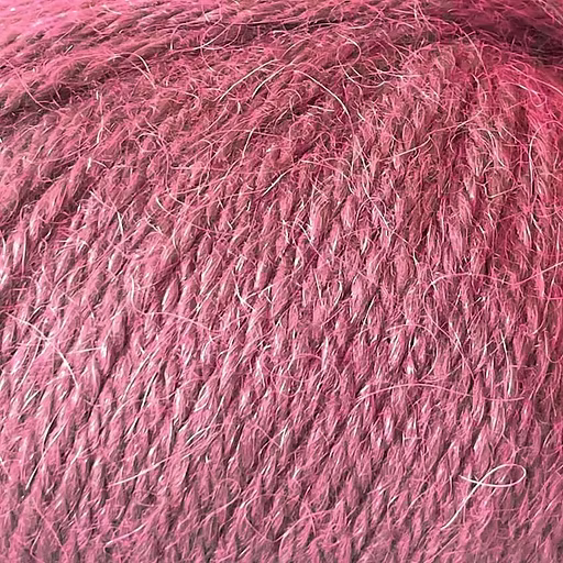 Close-up of bright pink yarn with alpaca and merino