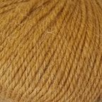 Close-up of ochre-gold yarn with alpaca and merino