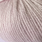 Close-up of light pink yarn with alpaca and merino