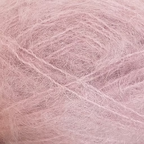 Close-up of pastel pink colored yarn with a fluffy mohair texture