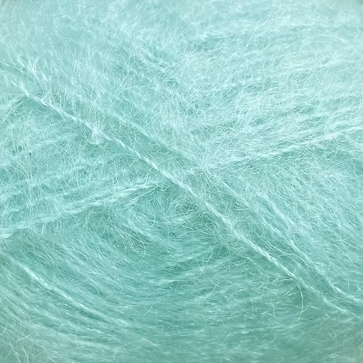 Close-up of aqua blue colored yarn with a fluffy mohair texture
