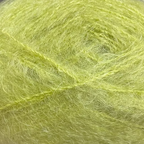 Close-up of chartreuse colored yarn with a fluffy mohair texture