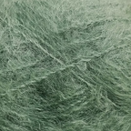Close-up of medium green colored yarn with a fluffy mohair texture