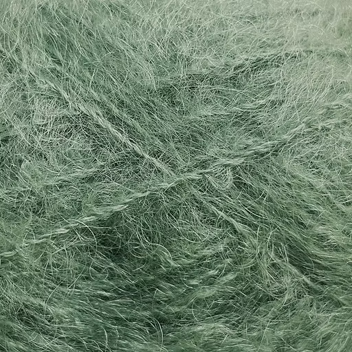 Close-up of medium green colored yarn with a fluffy mohair texture