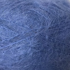 Close-up of deep lapis blue colored yarn with a fluffy mohair texture