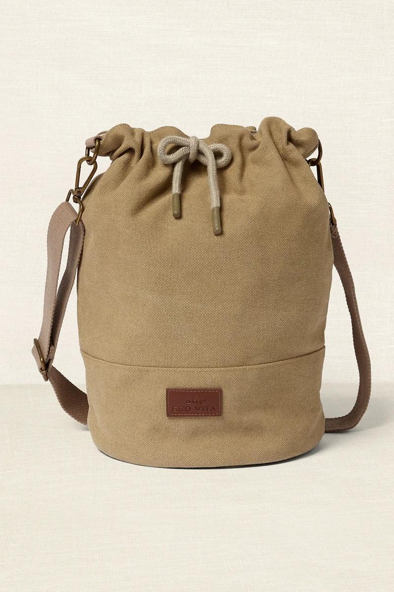 Beige drawstring bag on a beige background