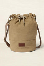 Beige drawstring bag on a beige background