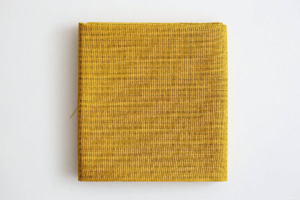 Yellow pre- printed Sashiko fabric on a white background