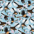 Quilt Fabric with New Zealand birds and flower blossoms on a blue sky background