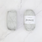 Two balls of Fiddlesticks Posie yarn in a silver grey colour