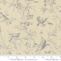 A Quilt fabric featuring a floral and bird design in blue tones on a light blue background, with a ruler at the bottom for scale.