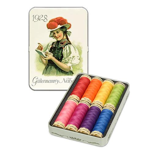 Set of colorful thread spools in a tin with vintage illustration on a white background