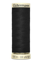 Spool of black thread with 'Gutermann' branding on a white background